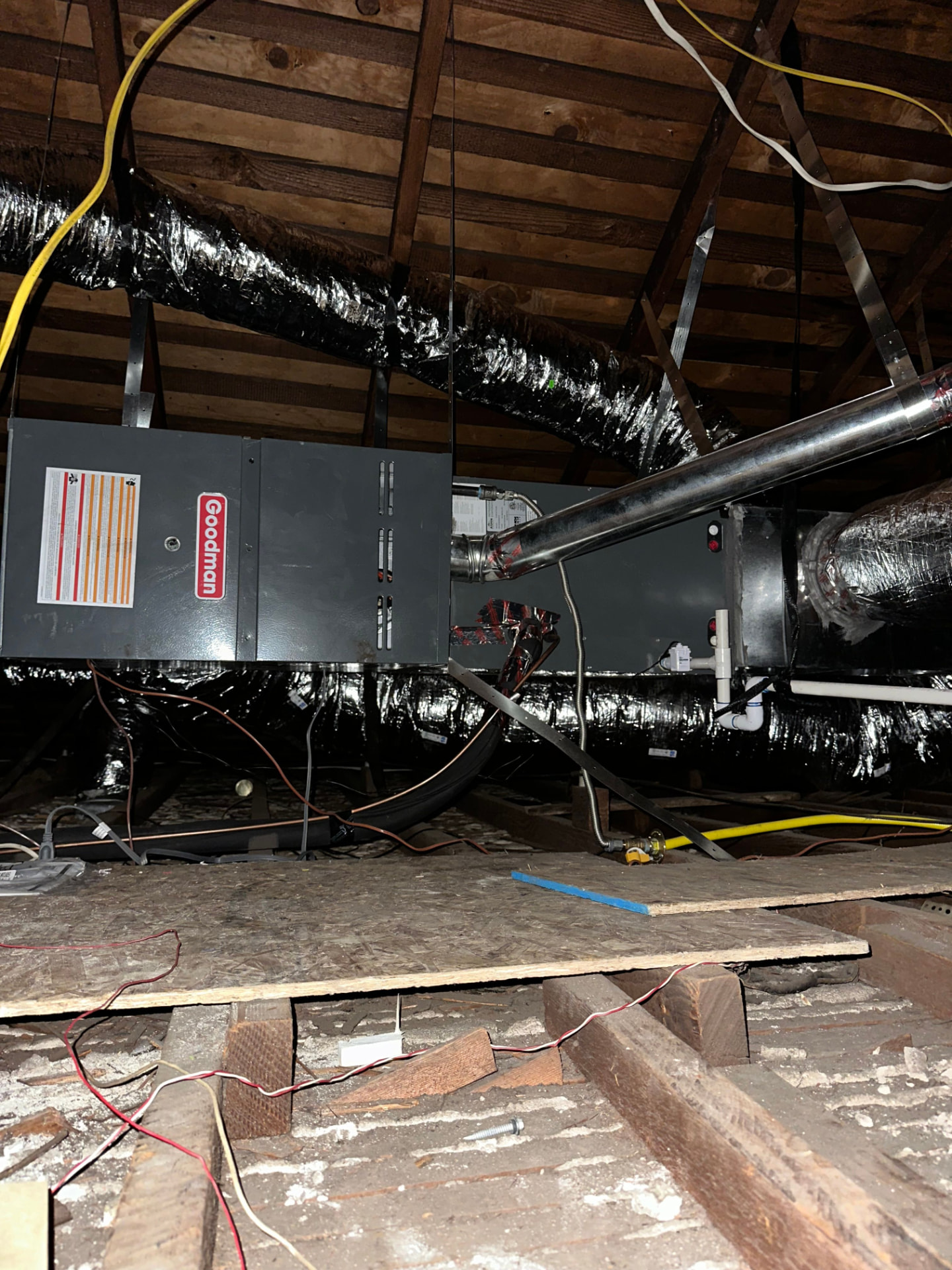 Attic furnace and coil connected to insulated ductwork and a new flue