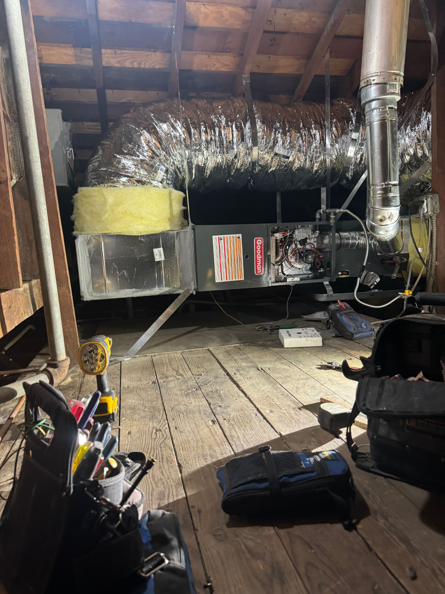 Newly installed attic furnace with return plenum and flue piping